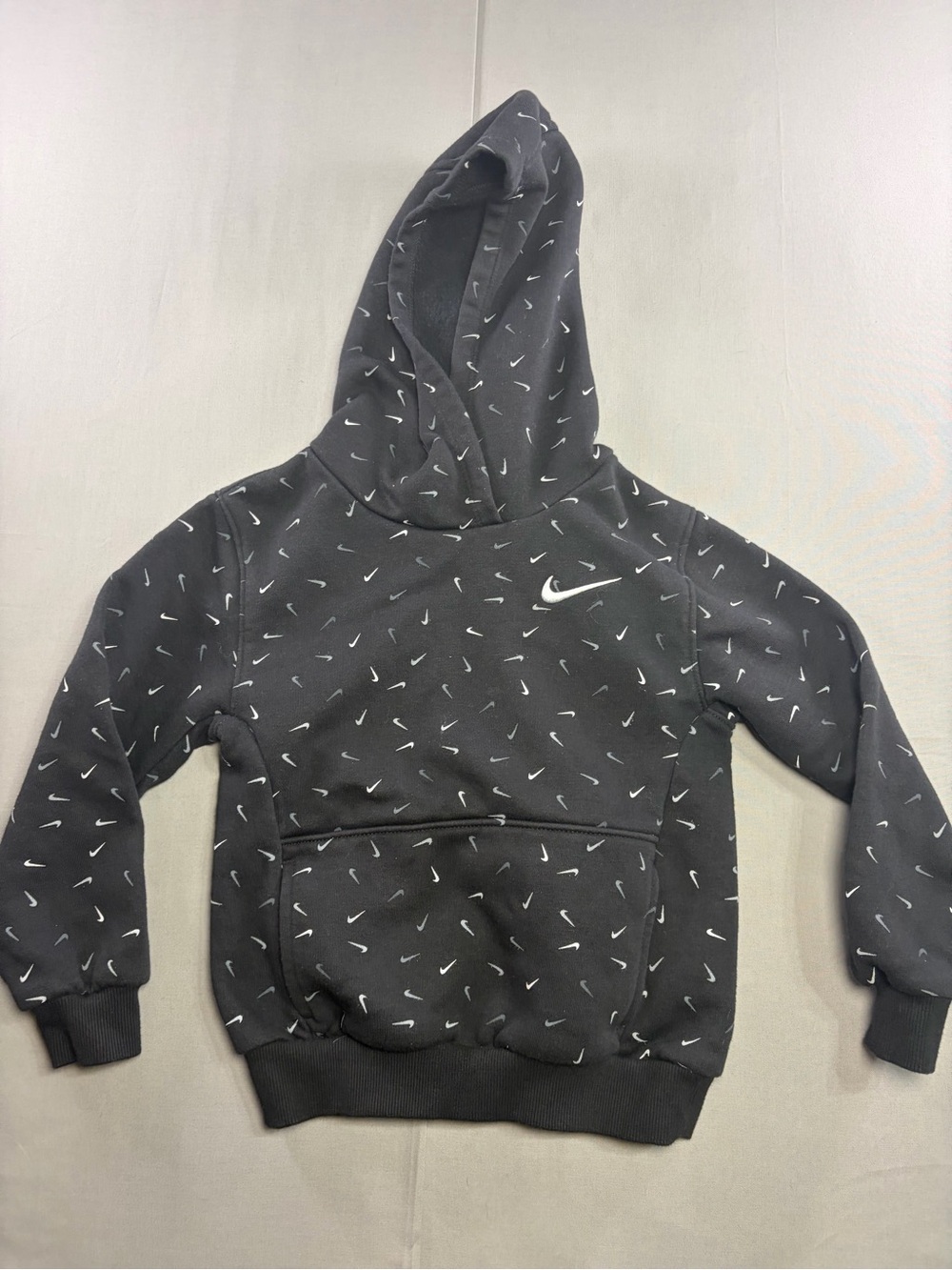 Nike Kids Black Hoodie with White Swoosh Pattern